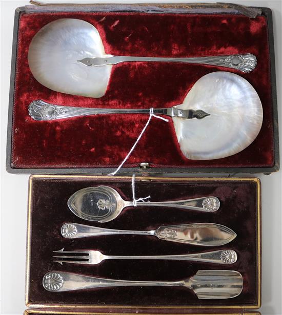 A pair of Dixon mother-of-pearl spoons with plated handles, cased, and a set of cased plated condiment servers